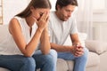 Depressed Couple Sitting Together After Break Up Conversation Indoor