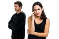 Depressed couple standing against white background Royalty Free Stock Photo