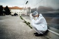 Depressed crying doctor with mask having mental breakdown.Fear,anxiety,panic attack due to coronavirus outbreak.Psychological Royalty Free Stock Photo