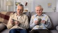Depressed elderly men counting money, low social payment, poverty problems Royalty Free Stock Photo
