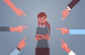 Depressed girl teenager being bullied surrounded by hands fingers mocking pointing her peer violence bullying concept Royalty Free Stock Photo