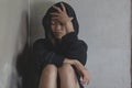 Depressed and hopeless teenage girl sitting alone after using drugs, Drugs addiction and withdrawal symptoms , No to drugs