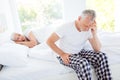 Depressed, ill, sick, temperature gray hair man in checkered pan Royalty Free Stock Photo