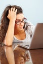 Depressed lady in front of laptop