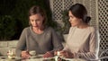 Depressed lady with supporting friend sitting in cafe, hard time, comforting Royalty Free Stock Photo