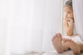 Depressed Little girl near window at home