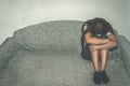 Depressed and lonely girl abused as young sitting alone in her room on the bed feeling miserable and anxiety cry over her life, da Royalty Free Stock Photo