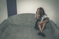 Depressed and lonely girl abused as young sitting alone in her room on the bed feeling miserable and anxiety cry over her life, da Royalty Free Stock Photo