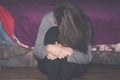 Depressed and lonely girl abused as young sitting alone in her room feeling miserable and anxiety cry over her life, dark image Royalty Free Stock Photo