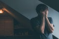 Depressed man is crying by the window of kitchen loft Royalty Free Stock Photo