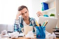 Depressed man without idea holding crumpled paper