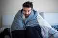 Depressed man portrait sitting on the bed Royalty Free Stock Photo