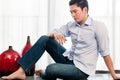 Depressed man sitting on apartment floor Royalty Free Stock Photo