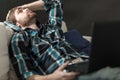 Depressed man sitting on the couch Royalty Free Stock Photo