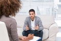 Depressed man speaking to a therapist Royalty Free Stock Photo