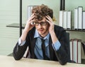 Depressed worker business manger with frustrated expression on office desk feeling despair about business problem