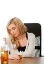 Depressed Polish woman drinking alcohol isolated on white background Royalty Free Stock Photo