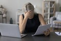 Depressed sad mature entrepreneur, business woman reading paper document