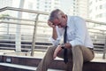 Depressed senior businessman in city Royalty Free Stock Photo