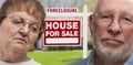 Depressed Senior Couple in Front of Foreclosure Sign and House