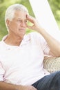 Depressed Senior Man Sitting In Chair Royalty Free Stock Photo