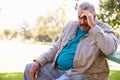 Depressed Senior Man Sitting Outside Royalty Free Stock Photo