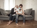 Mother and daughter crying at home in quarantine grieving loss of family members amid COVID-19 Royalty Free Stock Photo