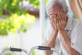 Depressed senior woman covering face with hands,Lonely old people crying alone at home,loneliness,hopelessness,dejection,Sad Royalty Free Stock Photo