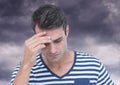 Depressed stressed man against dark clouds Royalty Free Stock Photo