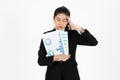 Depressed stressed young Asian business woman in suit suffering from severe depression over white isolated background. Failure and Royalty Free Stock Photo