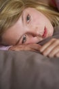 Depressed Teenage Girl Lying In Bedroom Royalty Free Stock Photo