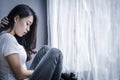 Depressed teenage girl sitting alone Royalty Free Stock Photo