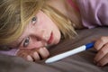 Depressed Teenage Girl Sitting In Bedroom Royalty Free Stock Photo