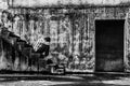 Depressed teenager sitting on stair in creepy abandoned building