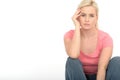 Depressed Thoughtful Unhappy Young Woman Sitting Alone on the Floor Looking Miserable Royalty Free Stock Photo