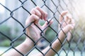 Depressed, trouble and solution. Women hand on chain-link fence. Royalty Free Stock Photo