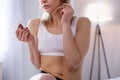 Depressed unhappy woman holding a tuft of hair