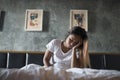 Depressed woman with headache hand holding her head