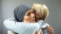 Depressed woman in headscarf hugging her mother, cancer treatment, diagnosis Royalty Free Stock Photo
