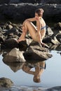 Depressed Woman Sitting On Rock Royalty Free Stock Photo