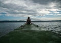 Depressed woman.Young girl depression,stress and problems,pain,female depressed.Young woman sitting on pier looking over horizon