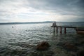 Depressed woman.Young girl depression,stress and problems,pain,female depressed.Young woman sitting on pier looking over horizon Royalty Free Stock Photo