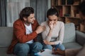 Depressed young european male calm crying female, on psychological consultation in clinic Royalty Free Stock Photo