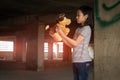 Depressed young girl standing alone in an abandoned building,Neglected,Children with Behavioral and Emotional Disorders