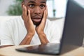 depressed young man holding head in hands Royalty Free Stock Photo