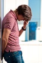 Depressed young man standing Royalty Free Stock Photo