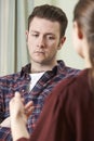 Depressed Young Man Talking To Counsellor Royalty Free Stock Photo