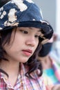 Depressed young woman bends down head sitting with blurred friend beside. Royalty Free Stock Photo