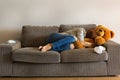 Depressed young woman crying on the couch, stress, anxiety, loneliness Royalty Free Stock Photo