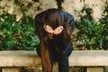 Depressed young woman holding head in hands feeling hurt upset, sad having psychological trauma Royalty Free Stock Photo